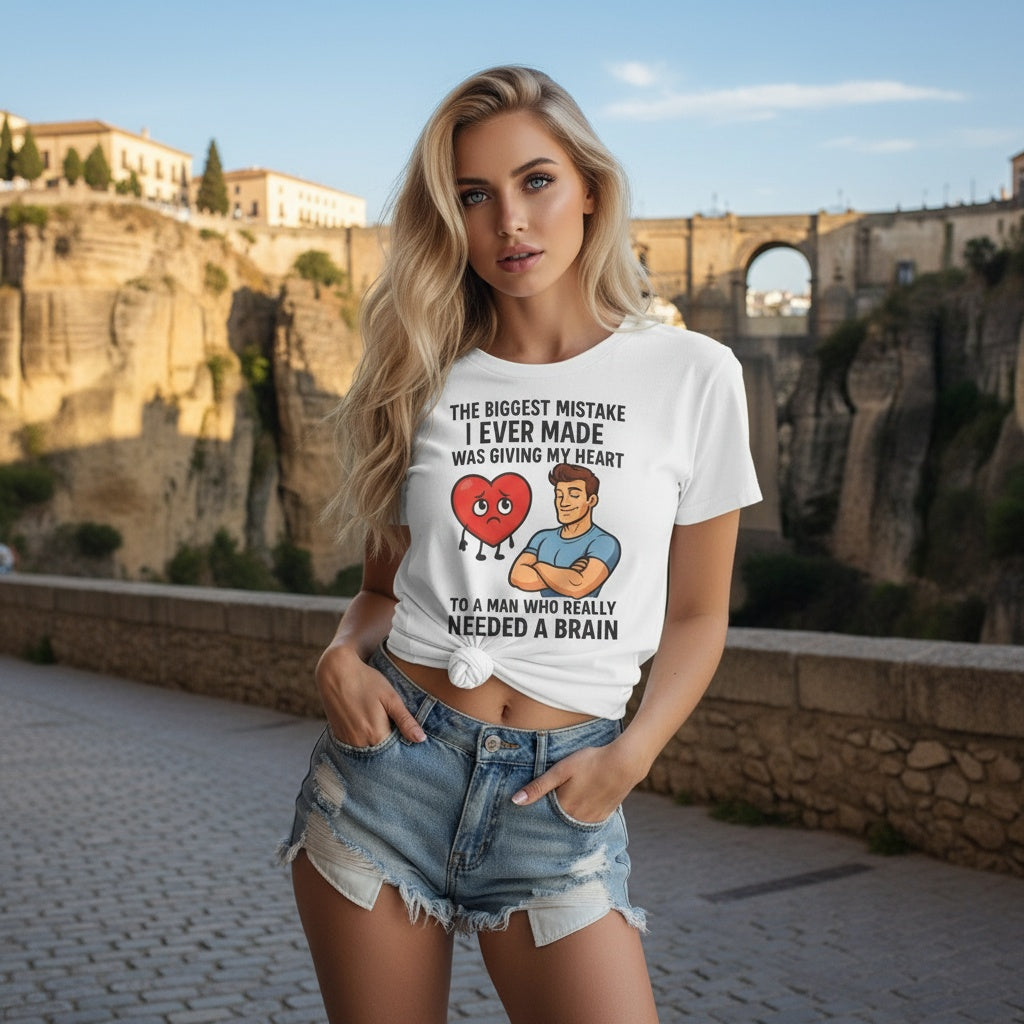 Woman wearing a black empowerment t-shirt that says the biggest mistake I ever made was giving my heart to a man who needed a brain rhonda spain