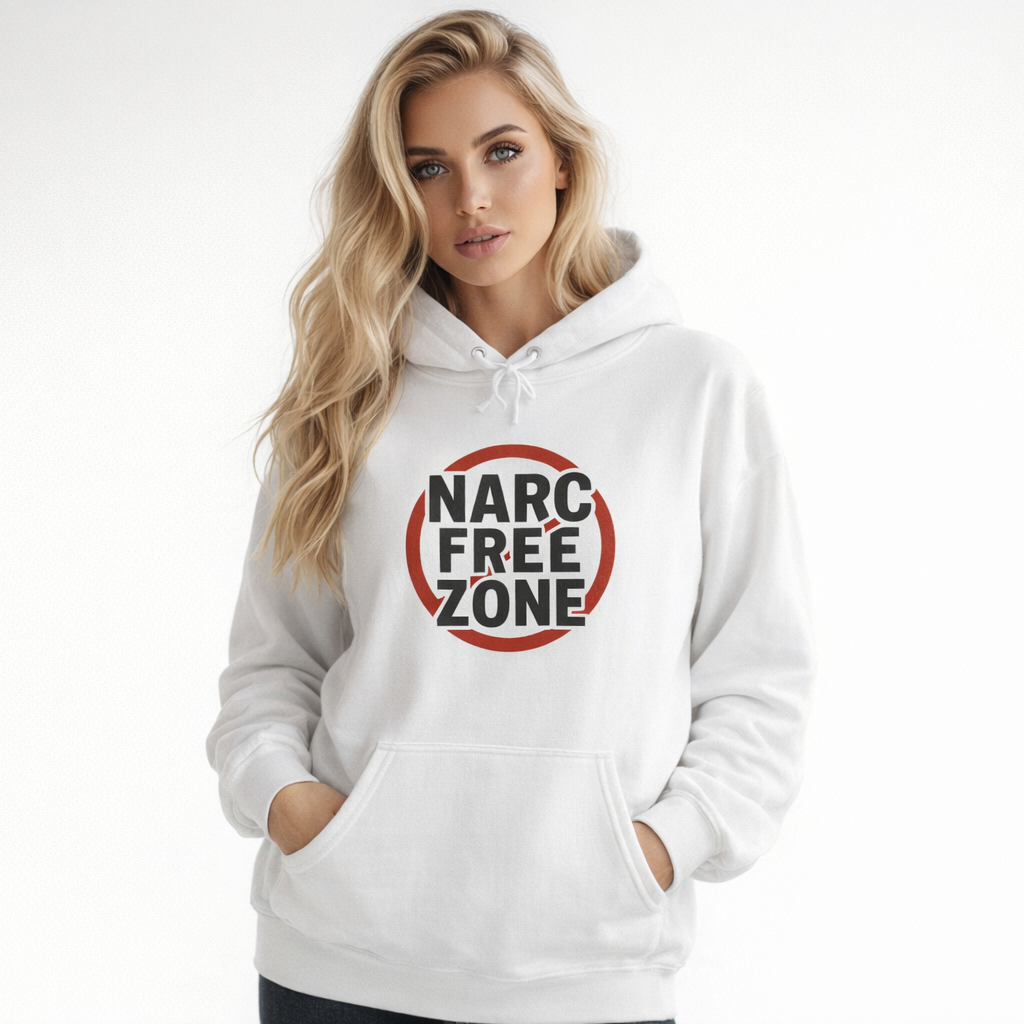 Woman wearing a white empowerment hooded sweatshirt with the quote narc free zone logo