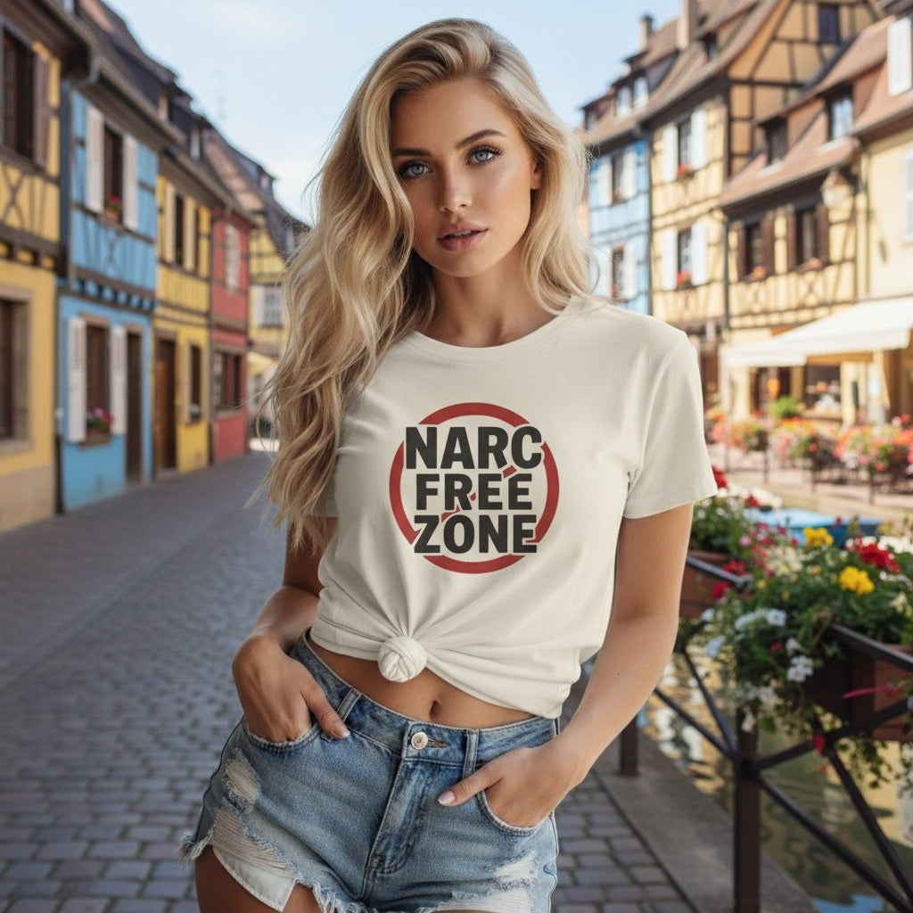 Woman wearing a white “Narc Free Zone” empowerment t-shirt in an Colmar France