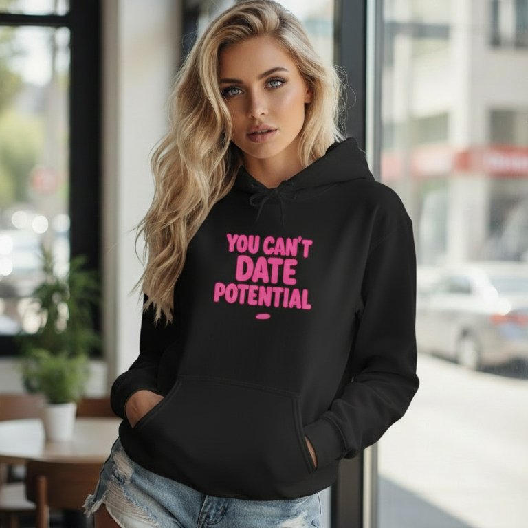 Woman wearing a black empowerment hooded sweatshirt that says you can’t date potential